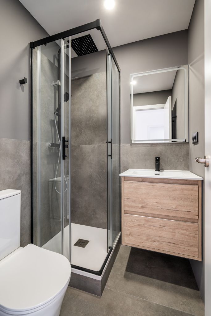 Small bathroom with bright lighting from white ceiling | 8 Tips For Small Bathroom Renovations In NYC | DCON Renovations New York - Brooklyn | Remodeling - Architectural Design - Residential Contractor - Brownstoner Experts