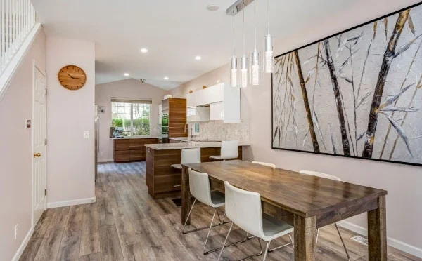 Modern dining area with a wooden table and leather chairs | Steps to remodeling your home | DCON Renovations New York - Brooklyn | Remodeling - Architectural Design - Residential Contractor - Brownstoner Experts